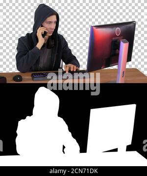 Experienced hacker answers someones call, Alpha Channel with Sil Stock Photo