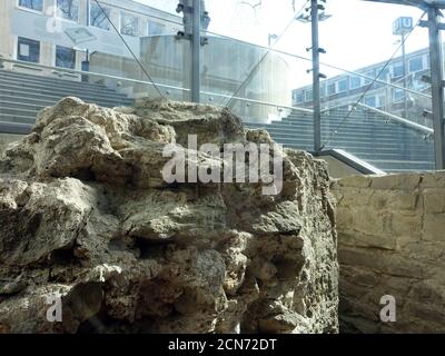 Remains of an ancient Roman temple in the entrance area of the Heumarkt underground station under a Stock Photo