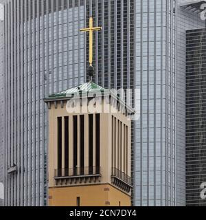 Old bell tower of the Matthaeus church in front of the modern Pollux office, Frankfurt, Germany Stock Photo