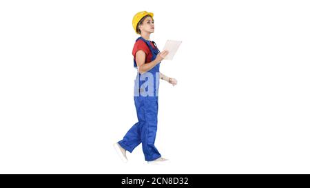 Construction lady using electronic tablet walking on white backg Stock Photo
