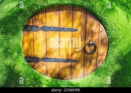 Wall in the garden made of natural wooden boards Stock Photo