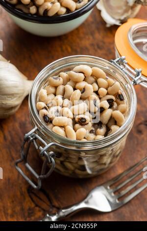 Marinated black eyed beans in jar. Stock Photo