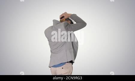 Arabian engineer with hardhat walking Safety concept on gradient Stock Photo