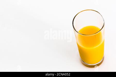 Glass of fresh orange juice isolated on white background. Vitamin C. Copy space. Stock Photo