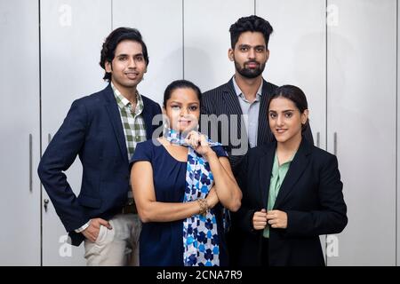 Portrait of confident Indian businesspeople, group of young entrepreneurs. Stock Photo