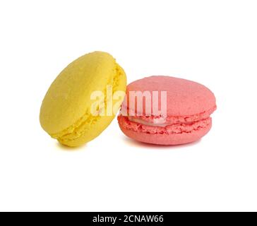 yellow and pink round baked macarons isolated on a white background Stock Photo
