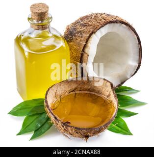 Cracked coconut fruit and coconut oil isolated on white background. Stock Photo