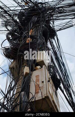 Cambodia, Siem Reap 12/08/2018 chaos in power lines, tangled city communications, problems with power supply Stock Photo