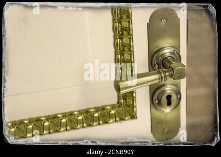 Brass vintage handle on white door Stock Photo