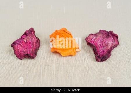 Healthy food organic nutrition. Sliced and dried carrot and beetroot  on textile background. Stock Photo