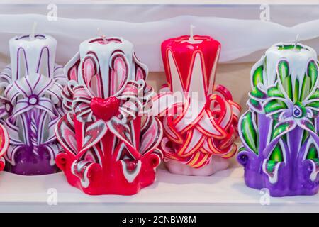 Moscow, Russia - February 14, 2019: Handmade carved colored candles for interior decoration. Stock Photo