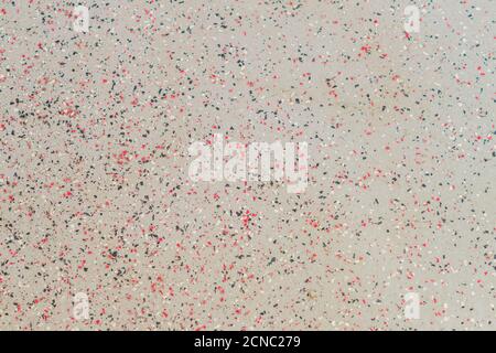 Seamless background texture. Grey concrete floor with red and black dots. Stock Photo