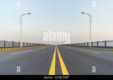 empty asphalt road surface on bridge Stock Photo