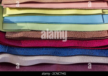 Leather samples of different colors for interior design and craft. Background texture. Stock Photo