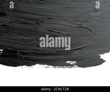swatch of black smudged acrylic paint isolated on white background Stock Photo