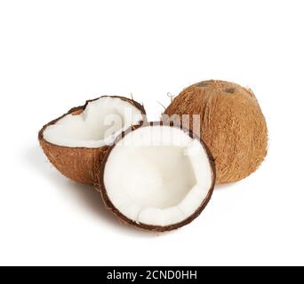 whole round and split in half ripe coconut isolated on white background Stock Photo