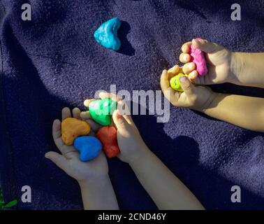 Plasticine modeling clay. Child dough play in school mold from plasticine  in kindergarten .Kids knead modeling clay with hands in preschool Stock  Photo - Alamy