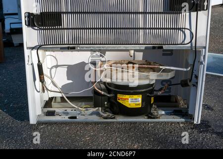 backside of a refrigerator outdoors Stock Photo