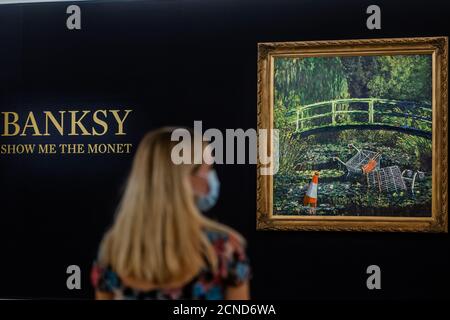 London, UK. 18th Sep, 2020. EMBARGOED TILL 13.30 Bst 18th SEPT - Show Me the Monet by Banksy, est £3-5m - To be sold as the highlight of the Modernites/Contemporary Evening Auction at Sothebys London, which will be live streamed on 21 October. Masks are worn and social distance enforced as a response to the Coronarius (covid 19) pandemic. Credit: Guy Bell/Alamy Live News Stock Photo