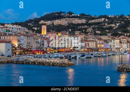 View from the port to the old town at dusk, Cassis, Bouches du Rhone, Provence, France, Mediterranean, Europe Stock Photo