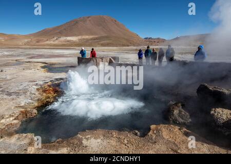 Tourists at the Geysers del Tatio (El Tatio), the third largest geyser field in the world, Andean Central Volcanic Zone, Antofagasta Region, Chile Stock Photo