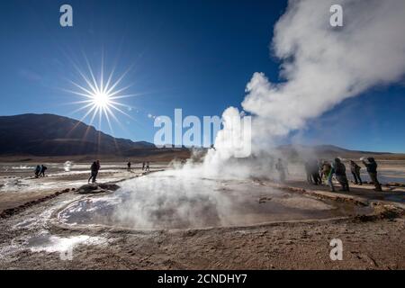 Tourists at the Geysers del Tatio (El Tatio), the third largest geyser field in the world, Andean Central Volcanic Zone, Antofagasta Region, Chile Stock Photo