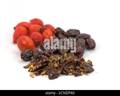 Dried rose hips against white background Stock Photo