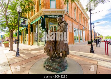 A statue of a Sioux Native American woman and her daughter in downtown Rapid City, South Dakota, United States of America Stock Photo