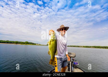 Man showing off his big catch of the day fishing on Yellowstone River, South Dakota, United States of America Stock Photo