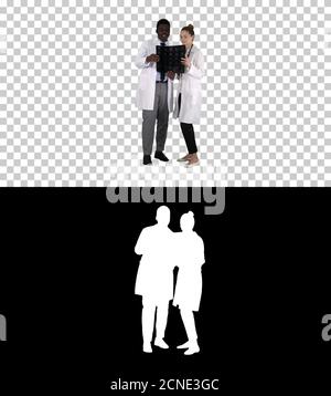 Serious nice woman doctor and afro american doctor study brain x Stock Photo