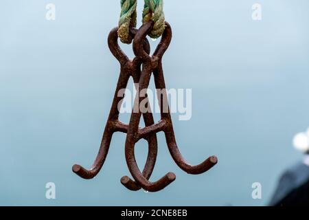 Fishing hooks hang in the air Stock Photo