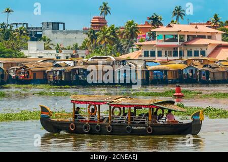 Tour boat and houseboats for the popular backwater cruises, a major tourist attraction, Alappuzha (Alleppey), Kerala, India, Asia Stock Photo