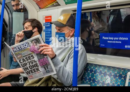 London, UK. 18th Sep, 2020. Cases up 75% headline - Passenger numbers remain down on the tube, but are now rising and trains are moderately busy. Just as the government begins to tighten its Coronavirus (covid 19) guidance again. Those who do travel mostly wear masks after they become mandatory on public transport. Credit: Guy Bell/Alamy Live News Stock Photo