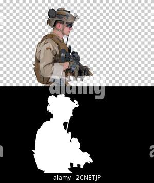 US Army ranger in uniform and weapon walking, Alpha Channel Stock Photo