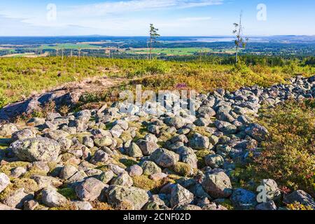 Landscape view with a old hillfort ruin at a clear cut area Stock Photo