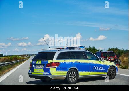 Freeway 20, Germany - August 30, 2020: Police car during a rescue operation on a motorway in Germany. Stock Photo