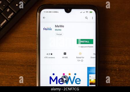 In this photo illustration a MeWe app seen displayed on a smartphone with  the MeWe logo in the background. (Photo by Thiago Prudencio / SOPA  Images/Sipa USA Stock Photo - Alamy