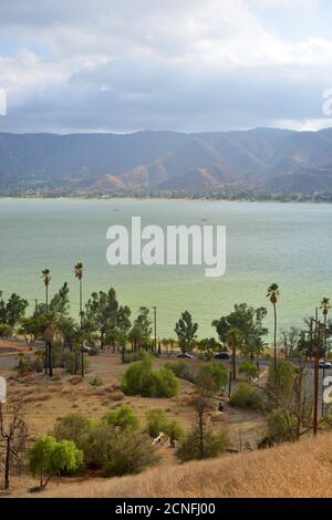 Lake Elsinore, California, USA, view from the hills to the Lake of destroyed housing structures from ancient wildfire, vertical view Stock Photo