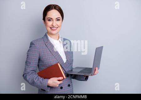 Distance learning concept. Close up photo of pretty smart confident clever educated lady using netbook to demonstrate presentation to students Stock Photo