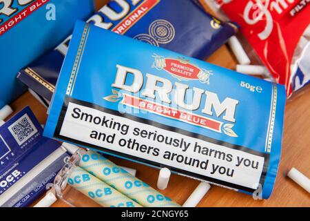 Moscow, Russia - September 17, 2020: Package of Drum Bright Blue rolling tobacco and smoking accessories Stock Photo