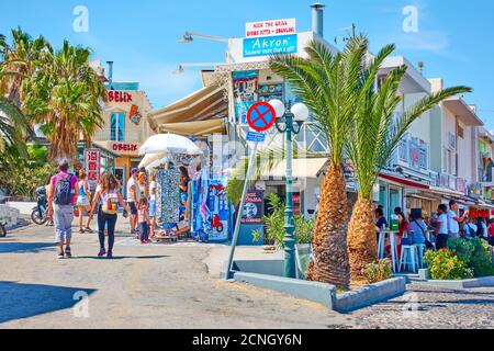 Fira, Santorini island, Greece - April 25, 2018: Shopping street with walking people in Fira (Thera) Stock Photo