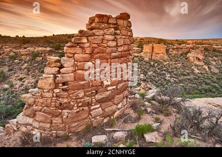 Eroded Boulder House, with Twin Towers in distance, at sunrise, Hovenweep National Monument, Colorado Plateau, Utah, USA Stock Photo