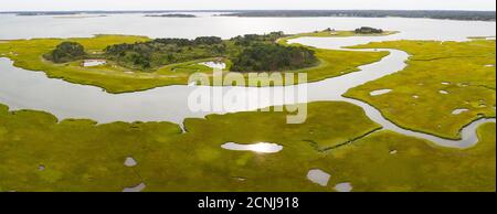 Salt marshes and estuaries are found throughout Cape Cod, Massachusetts. They provide calm nesting, feeding and breeding habitat for many species. Stock Photo