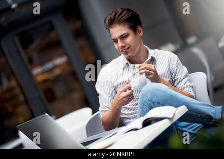 Authentic image of a pensive businessman in a coffee shop. Stock Photo