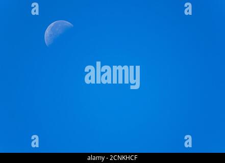 Waning crescent moon in blue sky, Bavaria, Germany, Europe Stock Photo