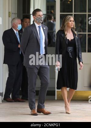 U.S. President Donald Trump's son Eric and his wife Lara walk down the West Wing colonnade as they arrive to attend as President Trump signs an executive order on police reform at a ceremony in the Rose Garden at the White House in Washington, U.S., June 16, 2020. REUTERS/Leah Millis