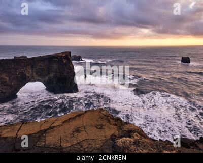 Deep view, panoramic view, surf, rocks, rock arch, evening sky, ocean, waves Stock Photo