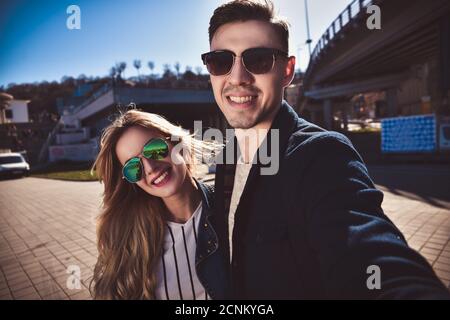 Pretty tourists make funny photos for travel blog in Europe. Stock Photo