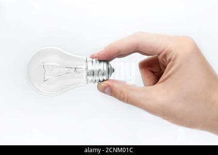 male hand holds a light bulb on a white background Stock Photo