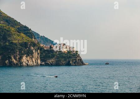 Lovely panoramic landscape view of Manarola, the second-smallest of the famous Cinque Terre towns. The small town with its colourful houses and... Stock Photo